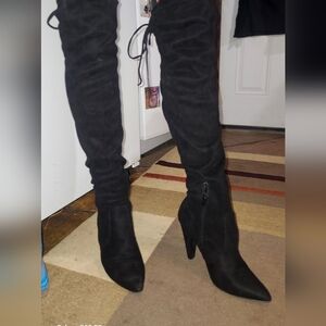 Black suede heeled knee boots.